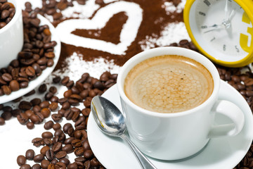 cup of espresso, heart and coffee beans conceptual photography, closeup