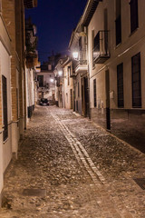 Evening in the narrow alley in the center of Granada, Spain