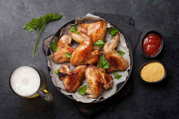 Hot chicken wings and draft beer