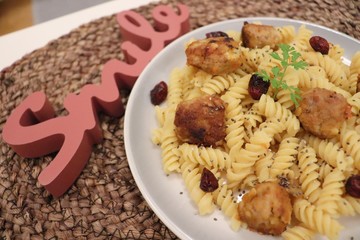 vegetable pasta dish with meatballs