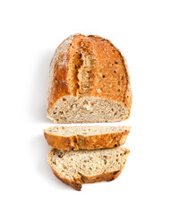 Loaf of whole wheat bread with slices isolated on white background