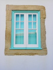 blue and white window in the wall