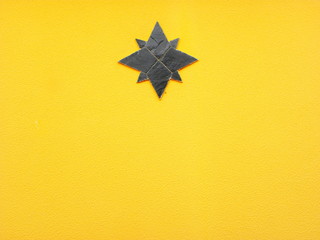 black star on the yellow wall
