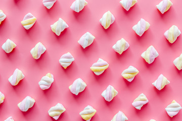 Marshmallows pattern on pink background top view flat lay