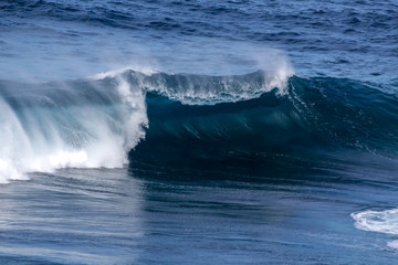 Wave breaking into a big barrel