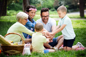 Multi generation family enjoying picnic in a park