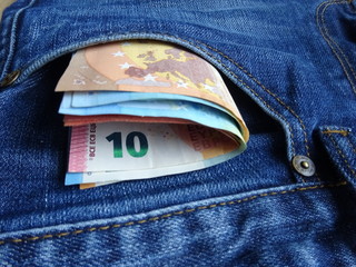Euro bill European Union paper money banknotes in jeans pocket