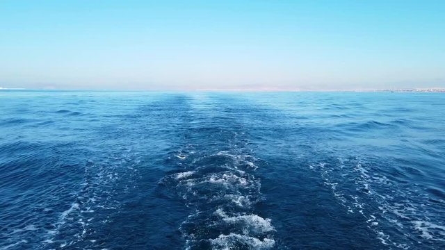 ripples behind a sayling yacht