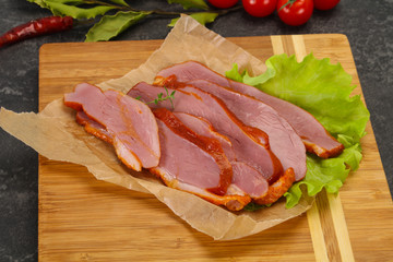 Sliced smoked duck breast served salad