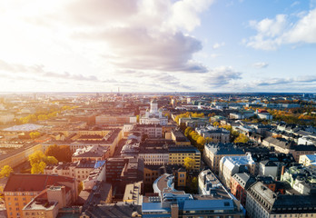 Aerial view of Helsinki Cathedral over the roofs of the city center at a beautiful sunset. Blue sky...
