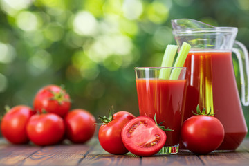 tomato juice in glass and jug