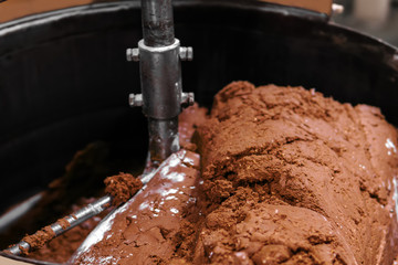 close-up of chocolate truffle filling in a mixing machine