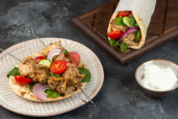 Souvlaki with vegetables wrapped in pita