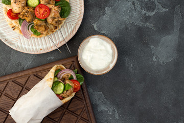 Souvlaki with vegetables wrapped in pita