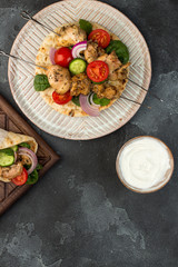 Souvlaki with vegetables wrapped in pita