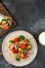 Souvlaki with vegetables wrapped in pita
