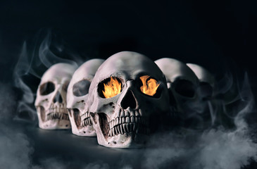 Human skulls on black background