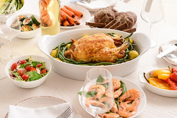 Many dishes served on table for big family dinner
