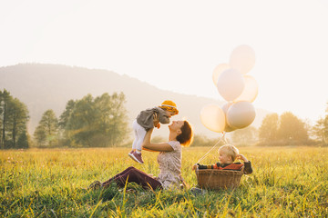 Mother with children outdoors. Family on nature.