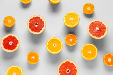 Sweet citrus fruits on color background