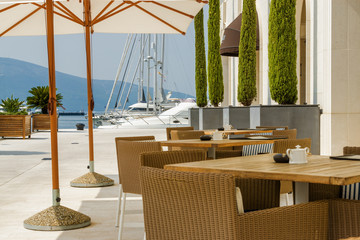 Beautiful cafe at sea promenade in Tivat, Montenegro. Kotor bay, Adriatic sea.