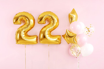 Figure 22 and different balloons on color background