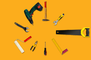 work tools on a yellow background