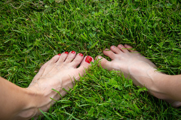 Naked feet and toes in fresh green grass