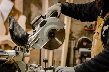 Carpenter using circular saw for wood