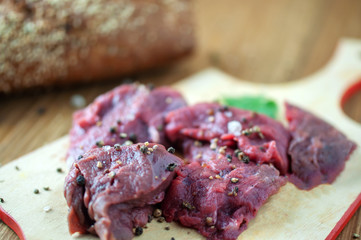 appetizing fresh meat with spices on a cutting Board