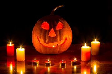 halloween night scene, jack o lantern pumpkin with candle on the table