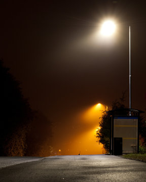 Bus stop in fog at night in Melhus Norway