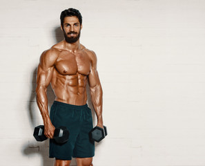 Handsome Muscular Men, Bodybuilder Lifting Weights. copy space