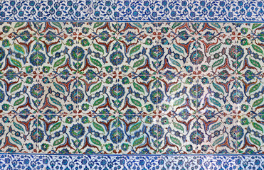 Ancient Iznik lapis tiles with paisley floral pattern close up background