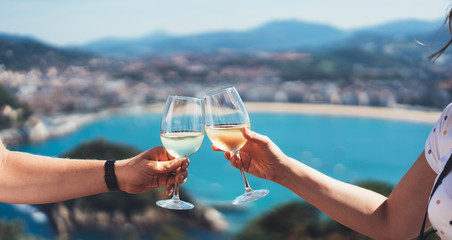 Drink two glasses white wine outdoor blue sea nature holidays, couple toast with alcohol, happy...