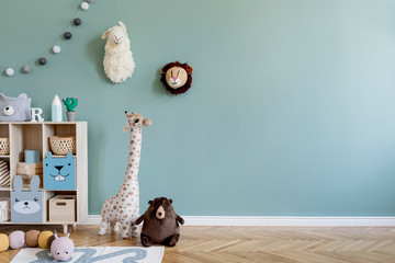 Interior design of scandinavian childroom with wooden cabinet, a lot of plush and wooden toys and...
