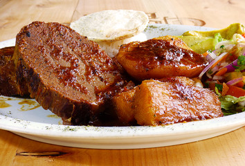 Traditional Colombian food called posta with rice, avocado, arepa, potato, yucca and salad