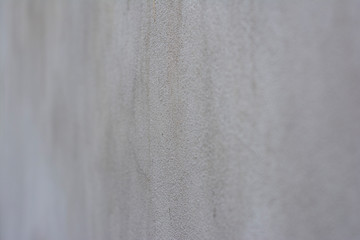 Background with a stone surface shot at an angle with a very small depth of field and a very blurred foreground and background