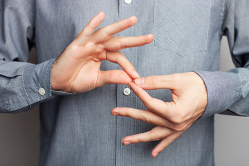 Man showing word interpreter, closeup view. American sign language
