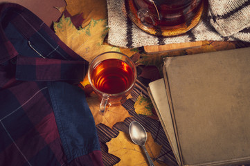 autumn, tea, old books, wool scarf and warm men's shirt