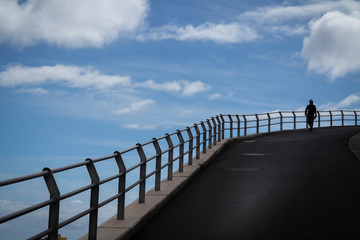man walking down a hill in spain