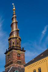 Church of Our Saviour in Copenhagen, 	Denmark. The black and golden spire reaches a height of 90 metres and the external staircase turns four times counterclockwise around it