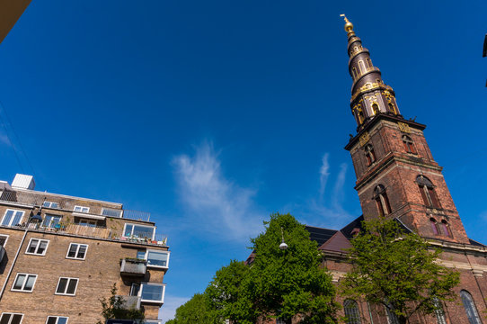 Church of Our Saviour in Copenhagen, 	Denmark. The black and golden spire reaches a height of 90 metres and the external staircase turns four times counterclockwise around it