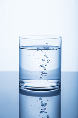 Drinking water in a glass with a drops