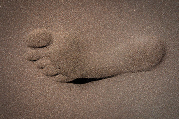 Fototapeta na wymiar foot print in the sand