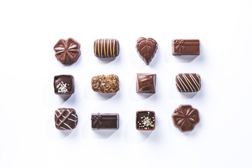 variety of chocolate pralines, symmetrical isolated on white background. .sweet and chocolate concept.