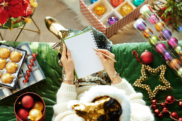 modern housewife on couch planning Christmas
