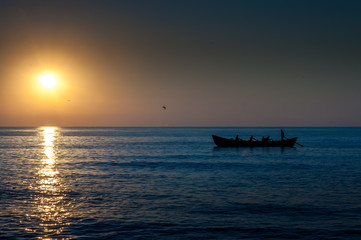 Fototapeta na wymiar Fishermen boat at sunrise Black Sea Romania