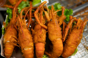 Fried king shrimps seafood by fire and BBQ Flames. Restaurant Barbecue at the night market.