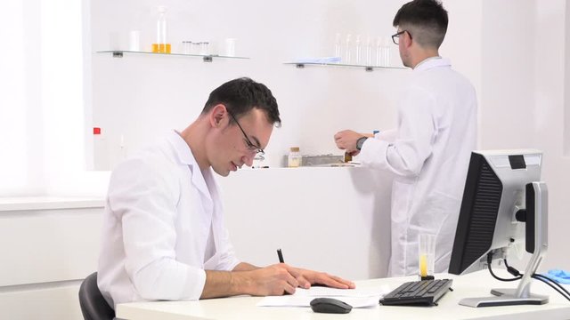 two colleagues and pharmaceutical workers invent new drugs